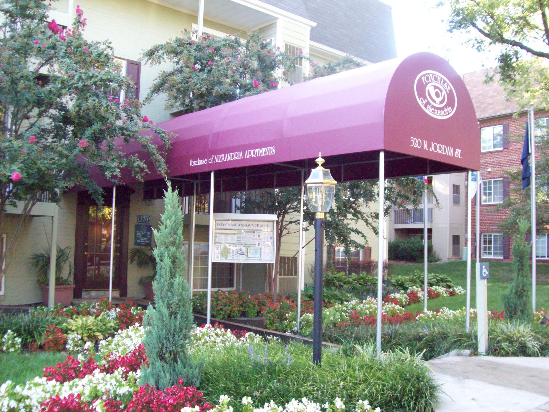 A building with a purple awning over the entrance