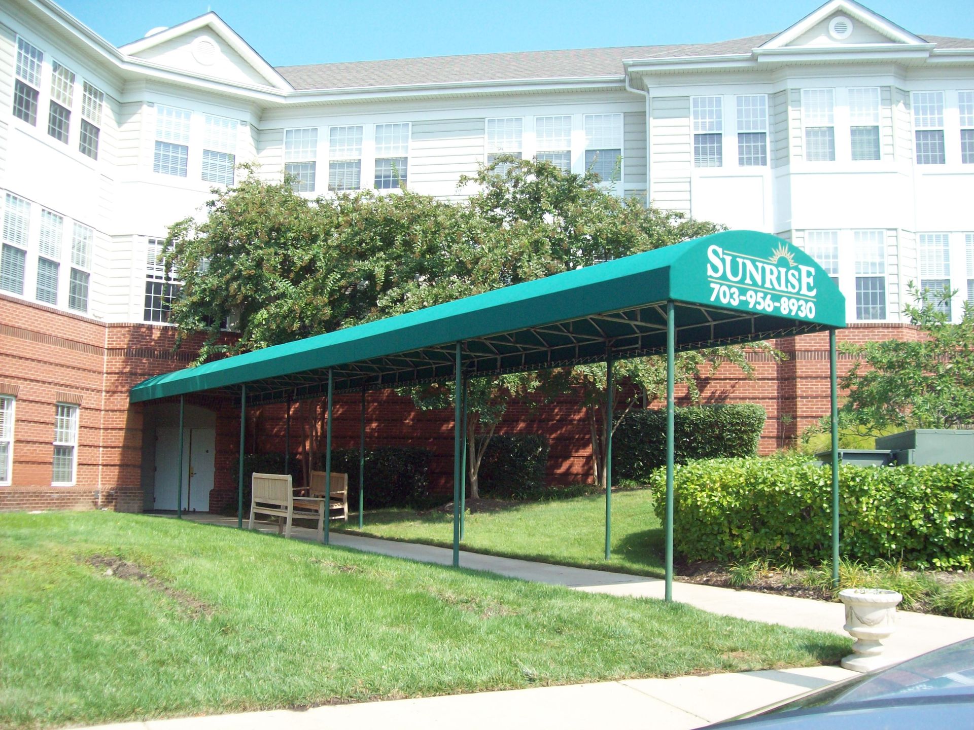 A green canopy with the word sunrise on it