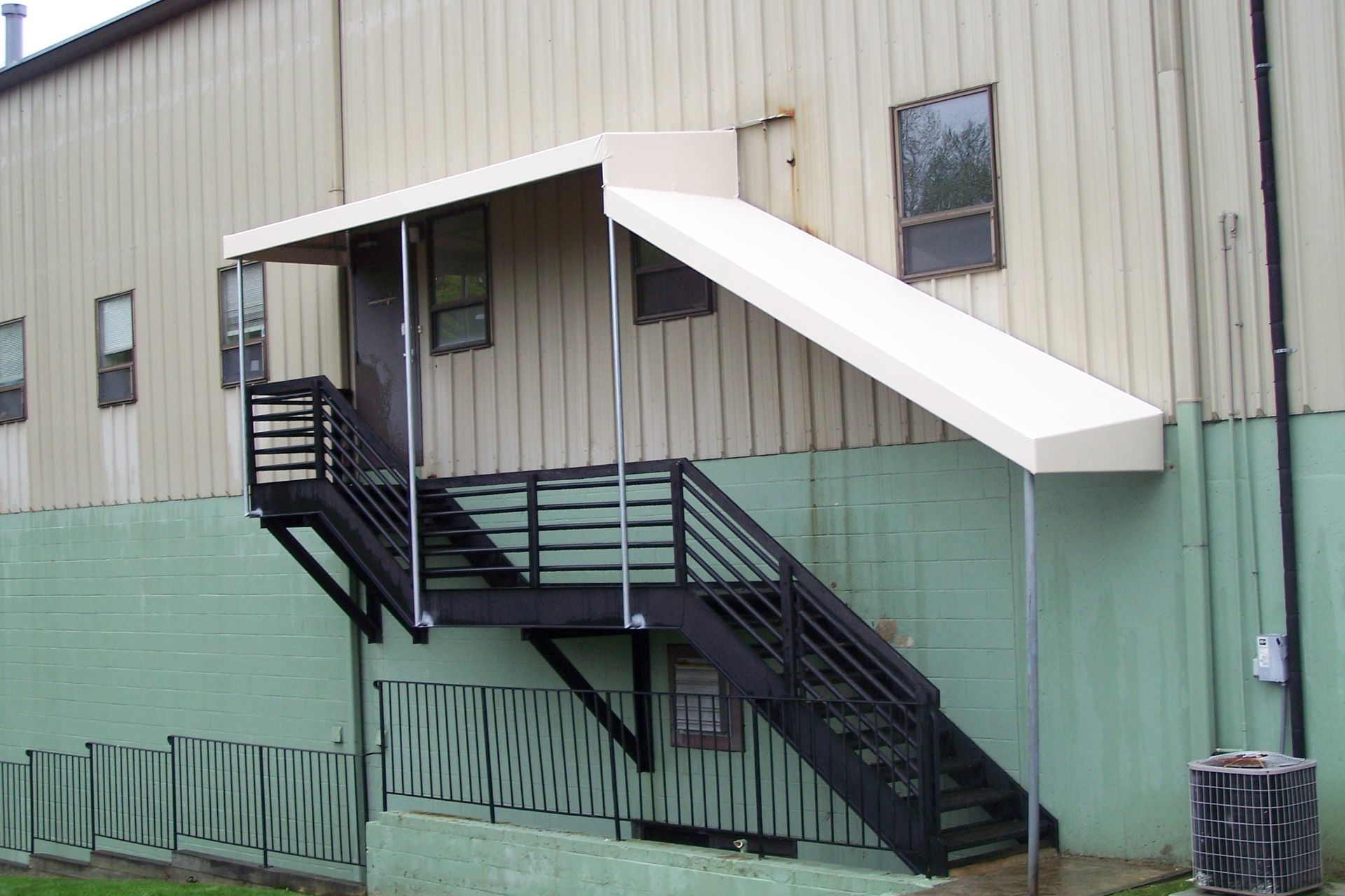 A building with stairs and a canopy over them