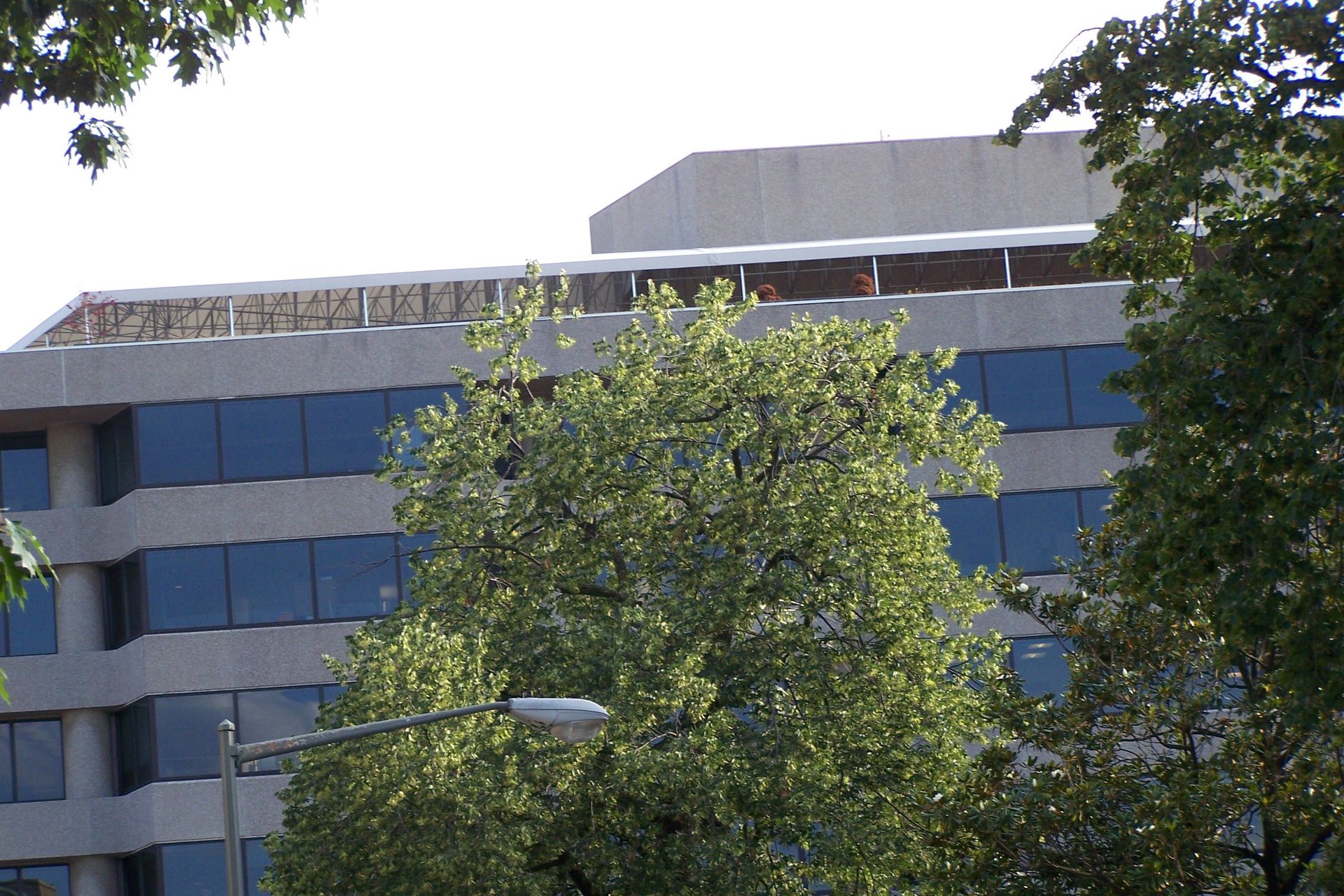 A large building with a lot of windows and a sign on the top that says ' united states of america '