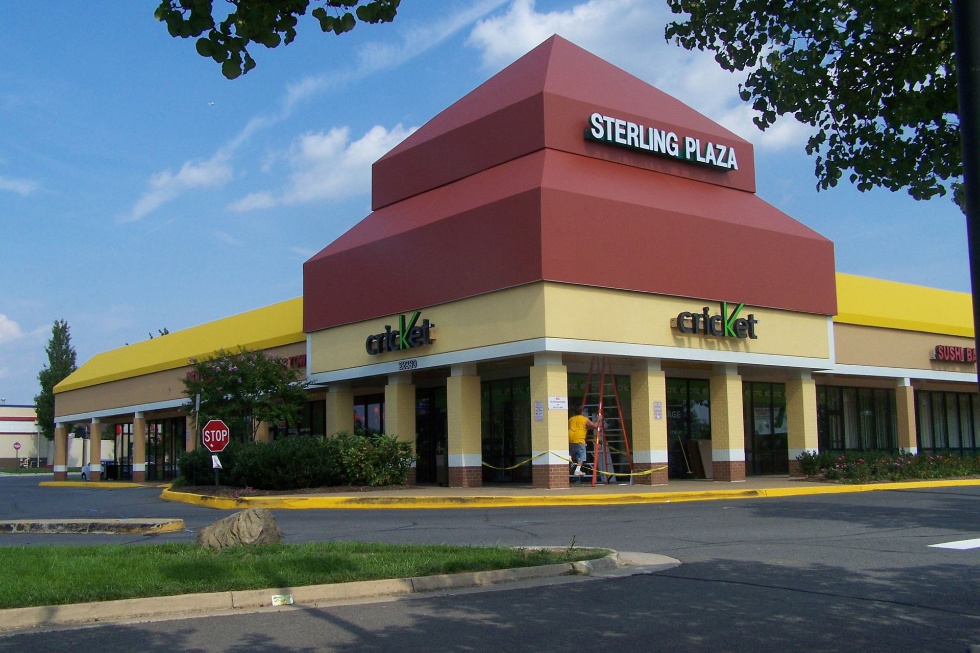 Sterling plaza is a shopping center with a red awning
