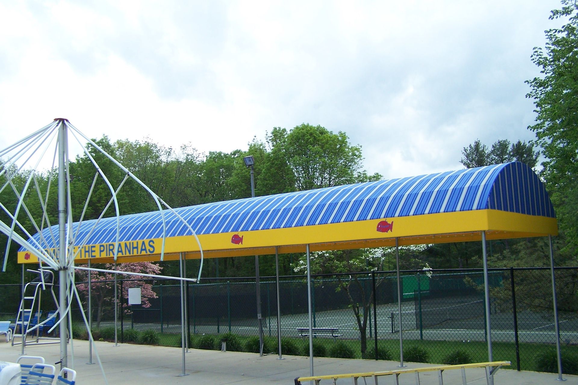 A blue and yellow awning that says french fries