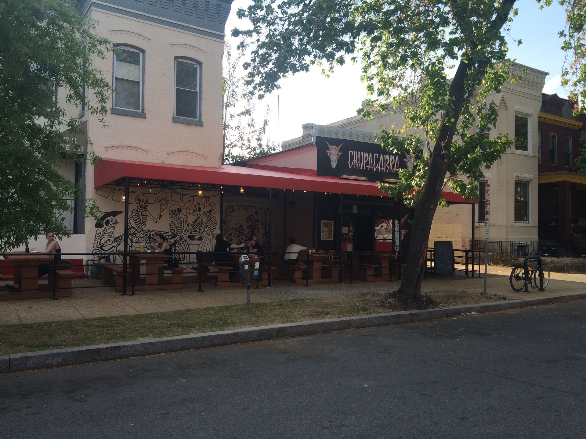 A restaurant with a red awning and a sign that says vikings