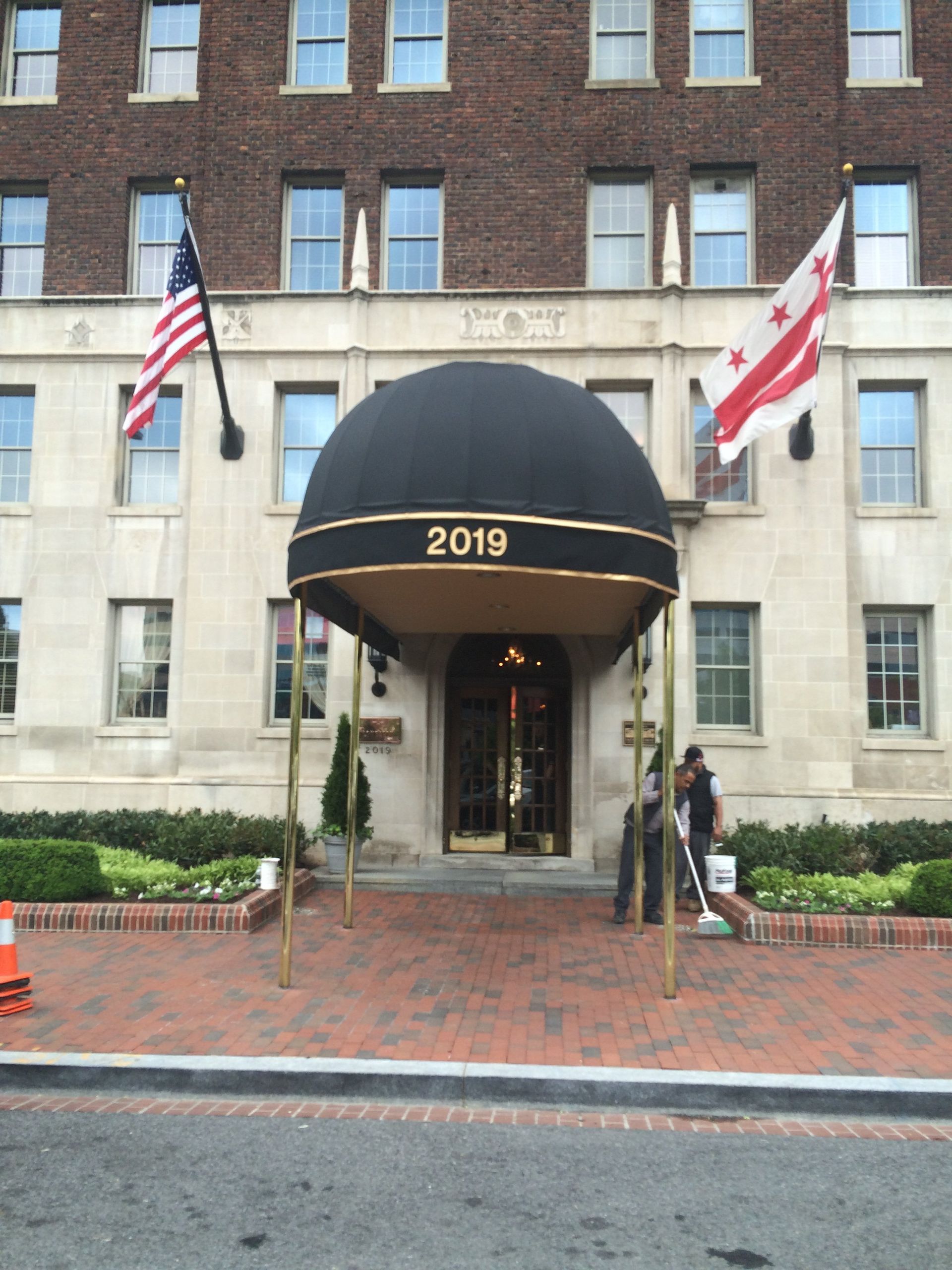 A building with a black awning