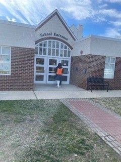 A large building with a tent on the side of it