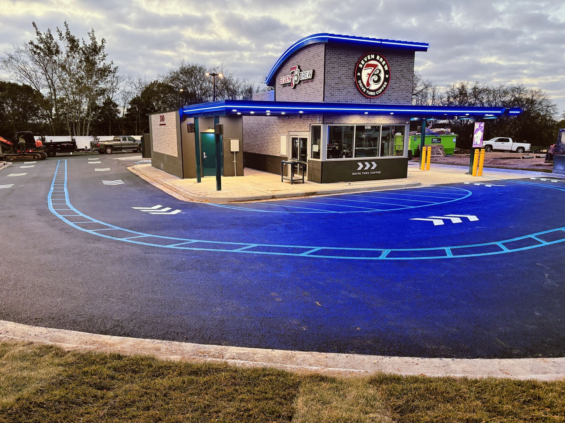 A fast-food restaurant with a blue drive-thru.