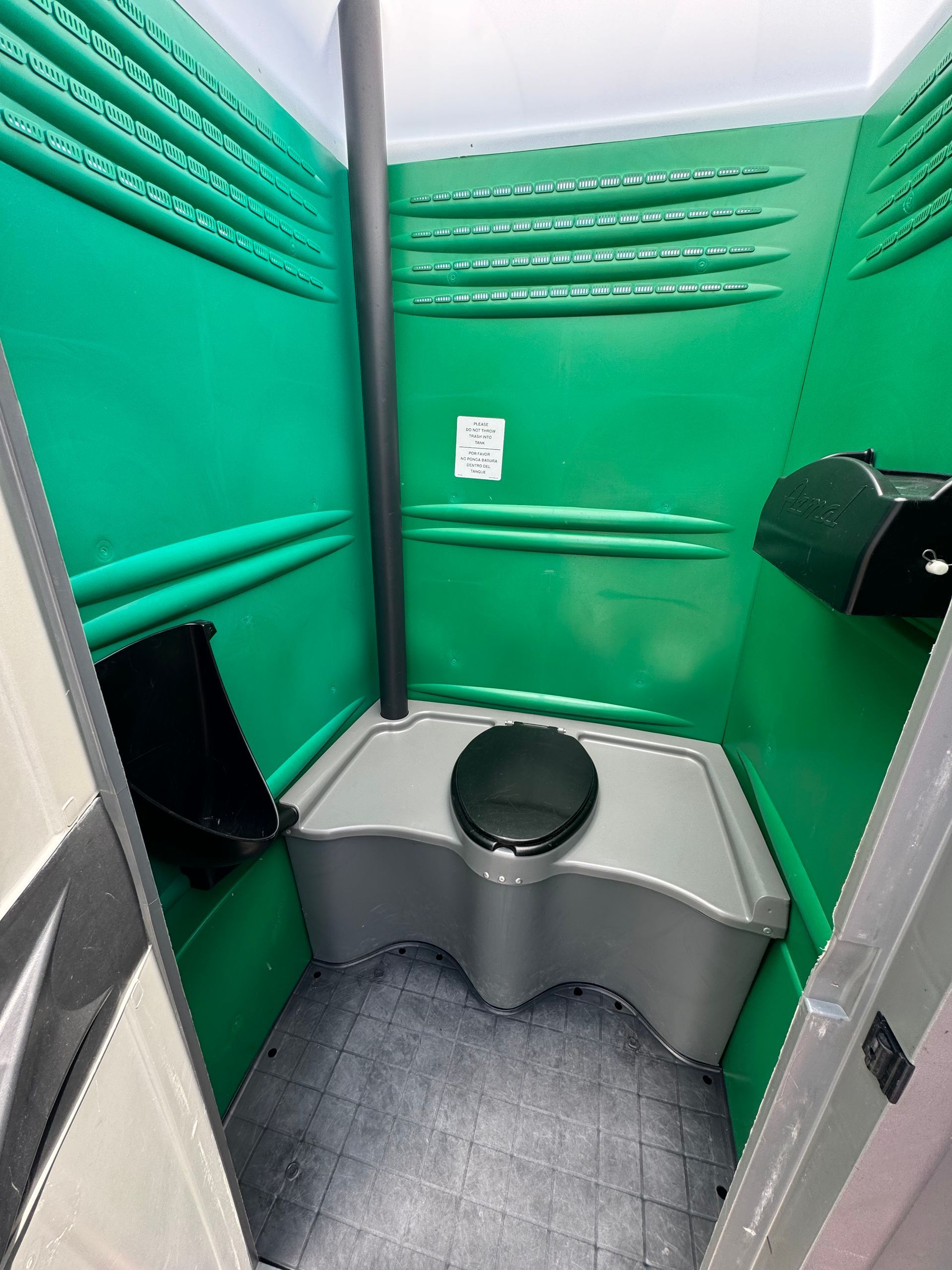 Interior of green Armal porta potty for sale. 