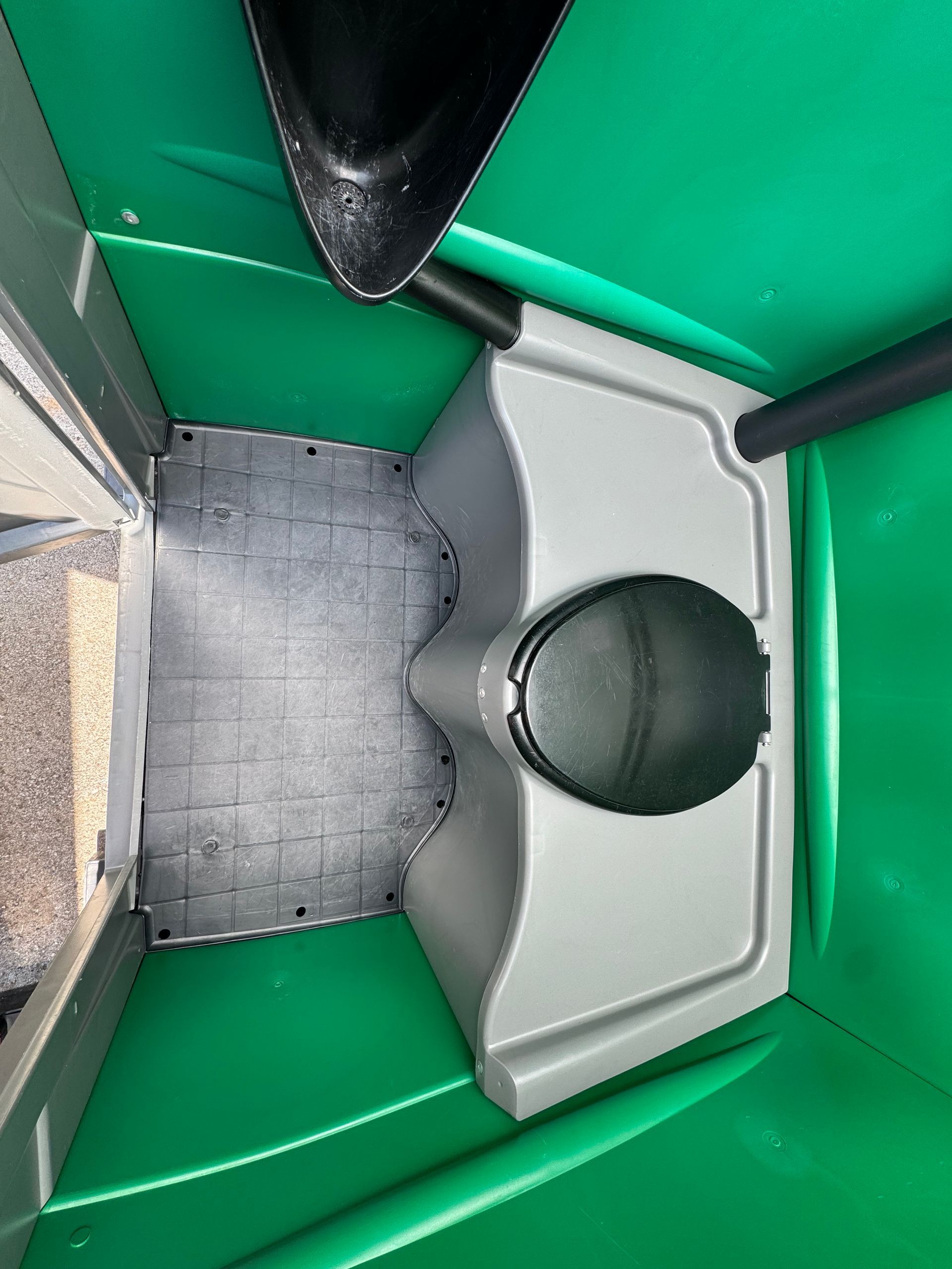 Interior of green Armal porta potty for sale in Nashville TN. 