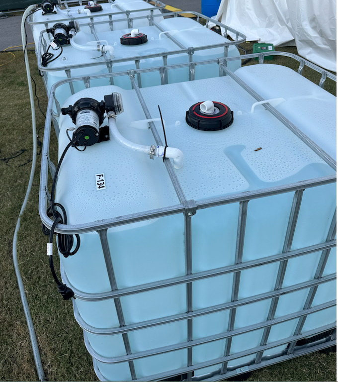 250 Gallon tote holding tanks with water pump for sale. 