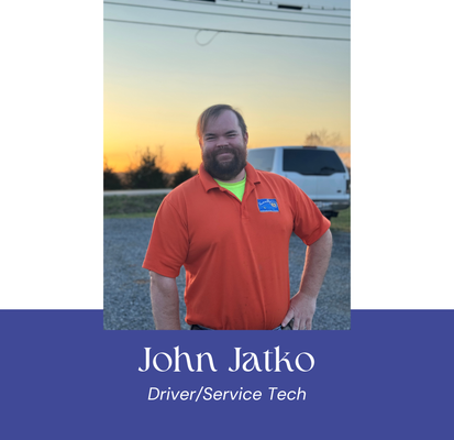 John Jatko, Driver/Service Tech, standing outside in an orange shirt with a sunset background.