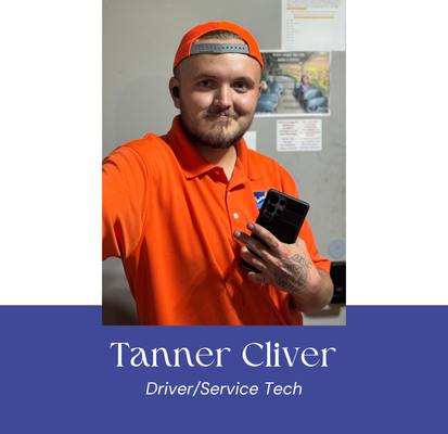 Man in orange shirt and hat holding phone, labeled as 
