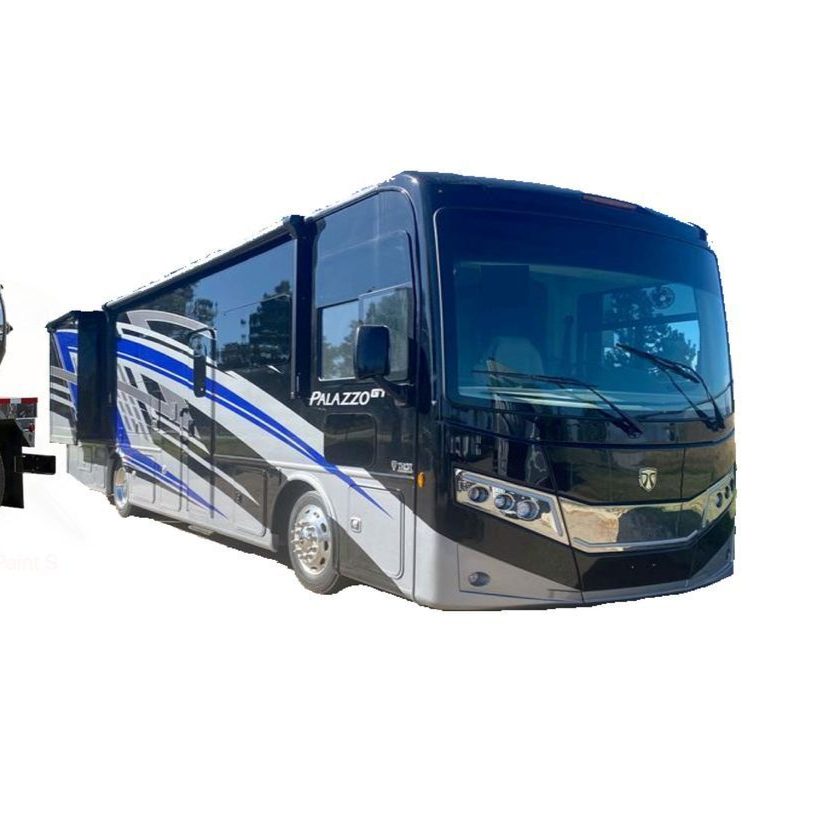 Black, blue, and silver Palazzo RV with slide-out extended, parked outdoors.
