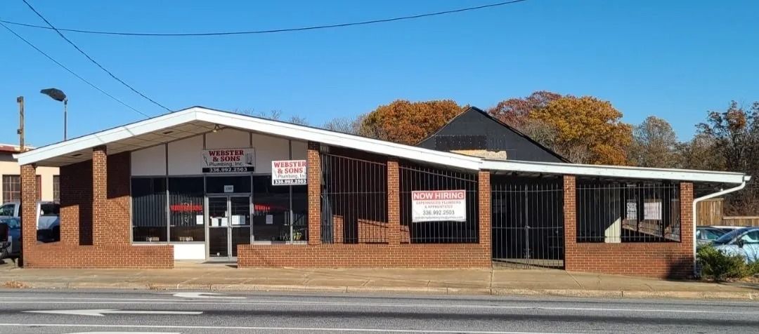 Brick building with a white angled roof and 