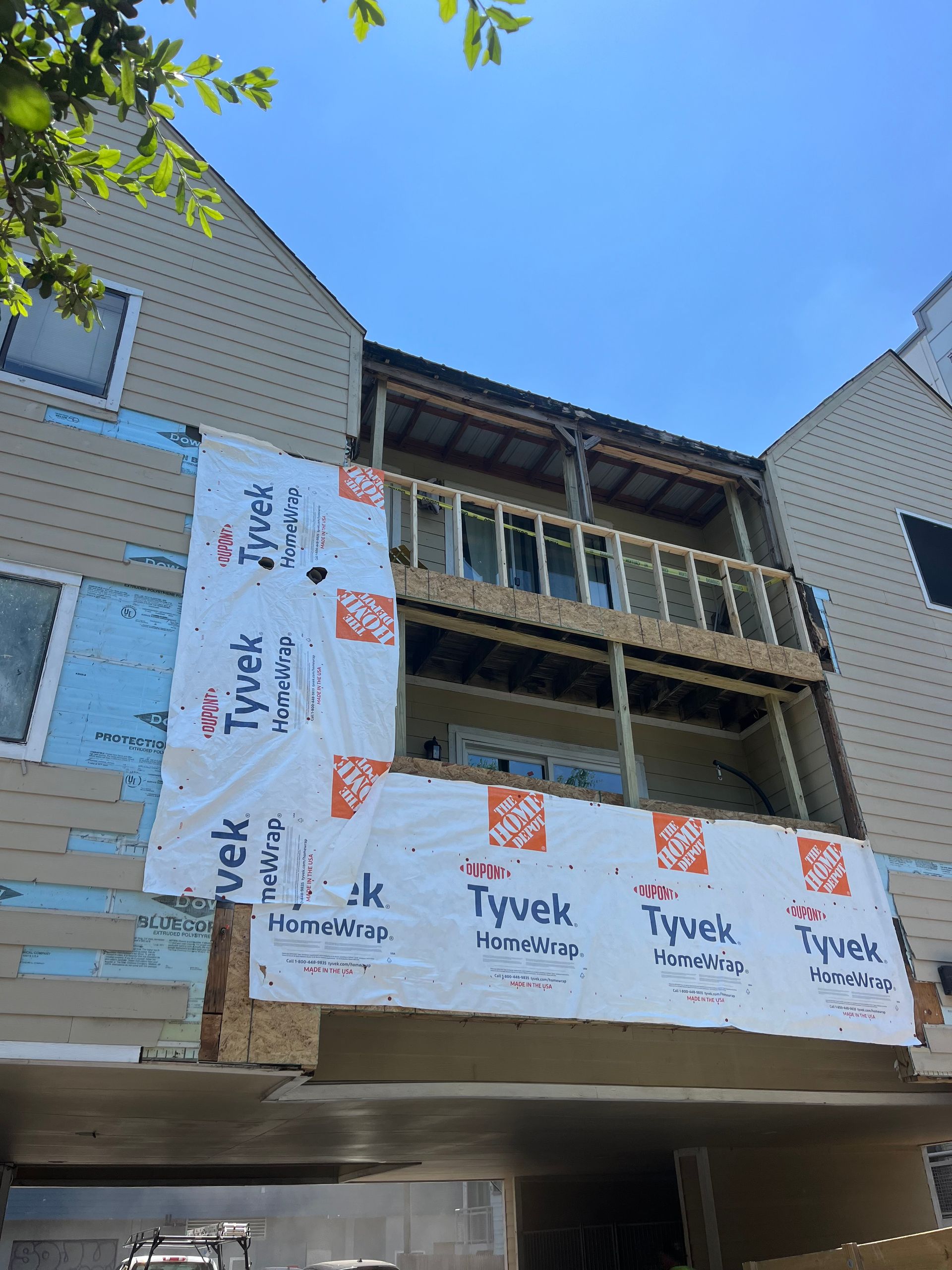 A building under construction with insulation on the side.