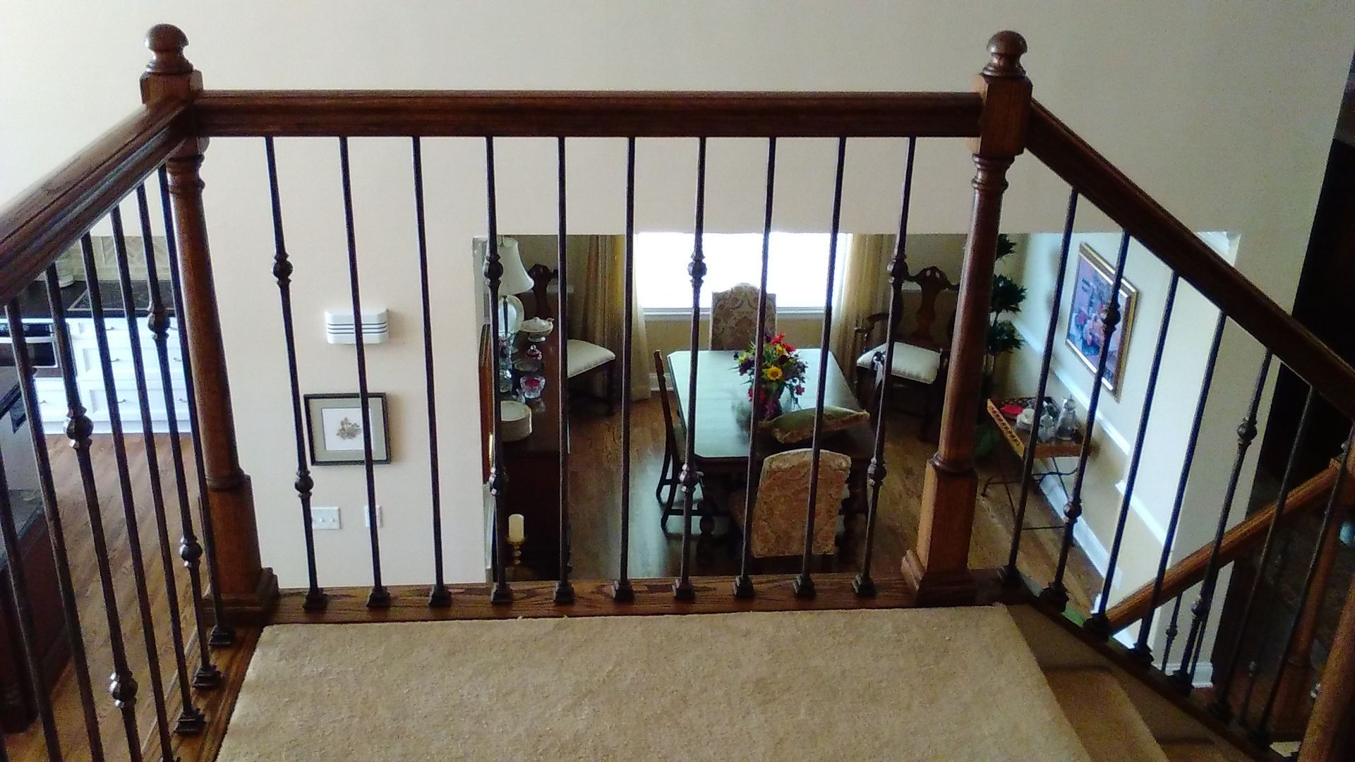 A view of a living room from the top of a staircase