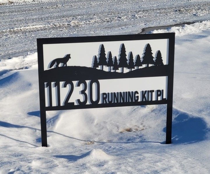 A sign in the snow says 112230 running kit pl