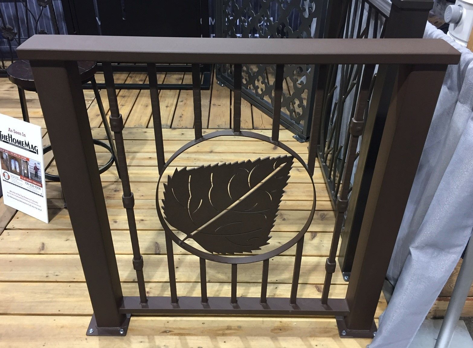 A wrought iron railing with a leaf design on it