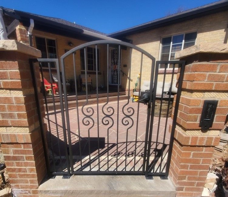 A wrought iron gate with the number 1896 on it