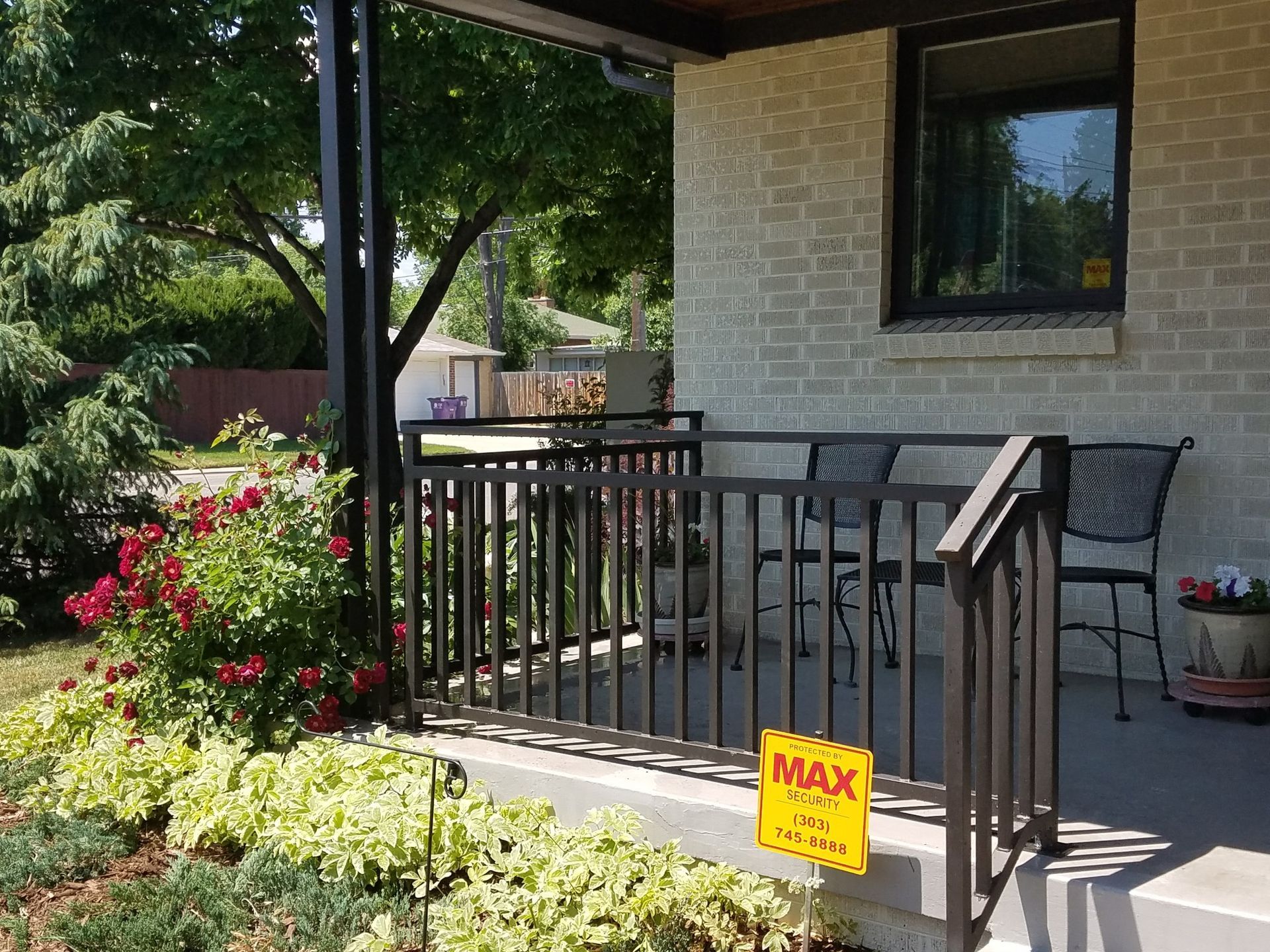 A porch with a sign that says max on it