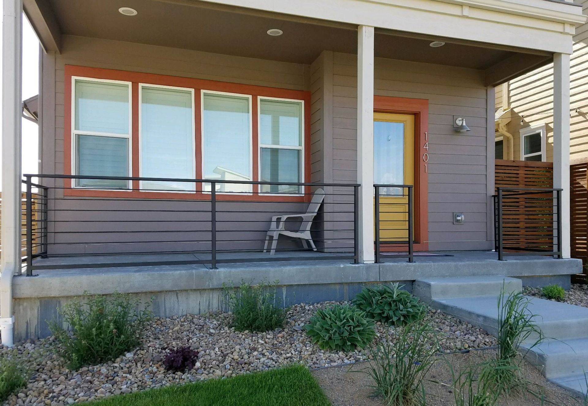 A house with a porch and a chair on it