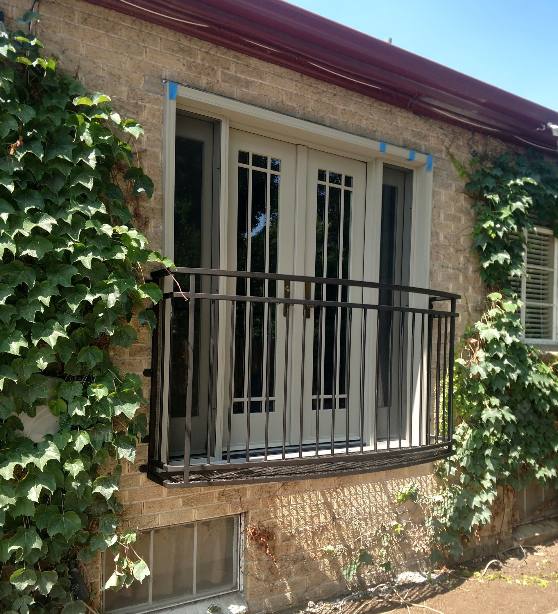 A house with a balcony on the side of it