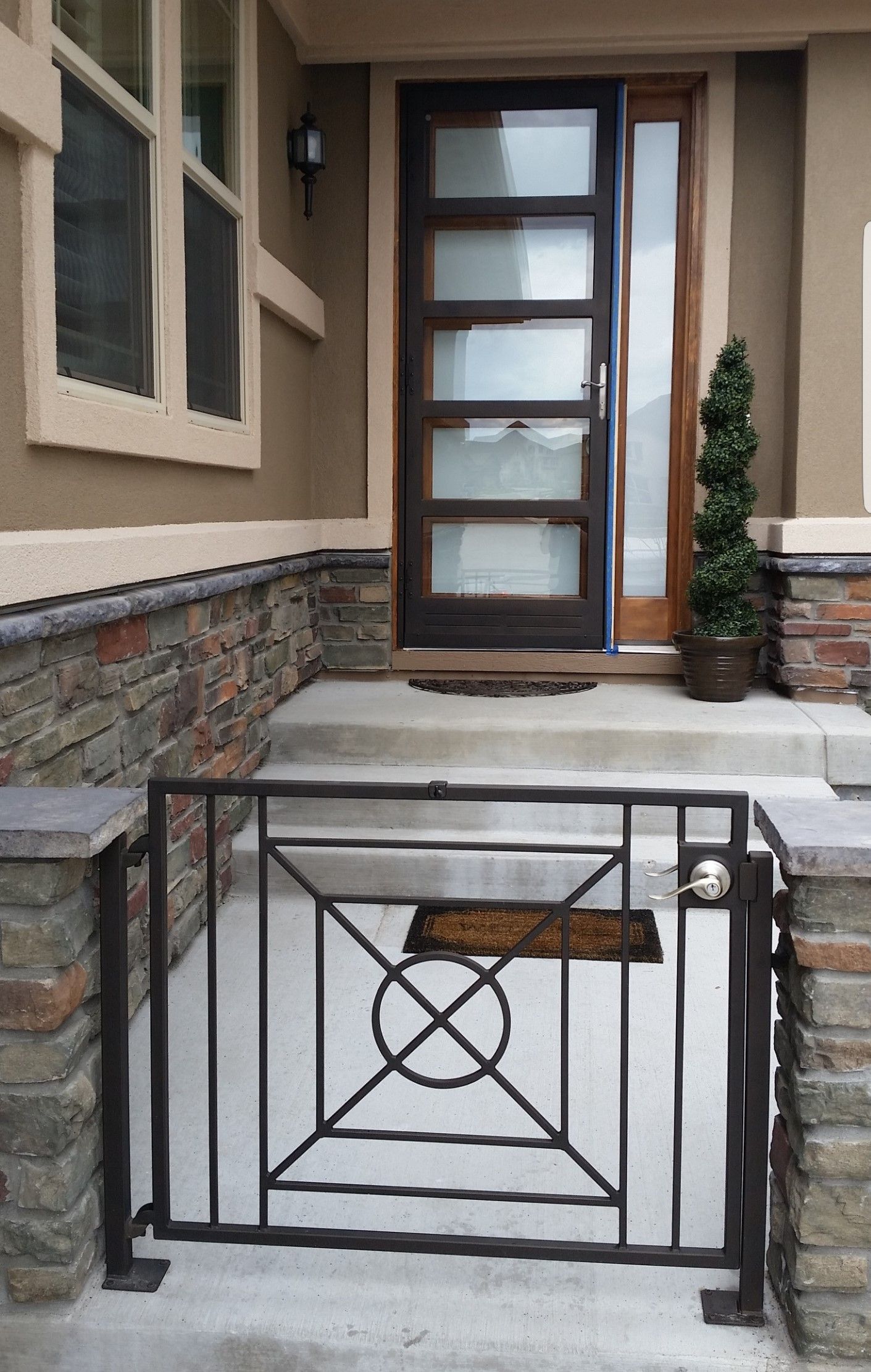 The front door of a house with a gate in front of it