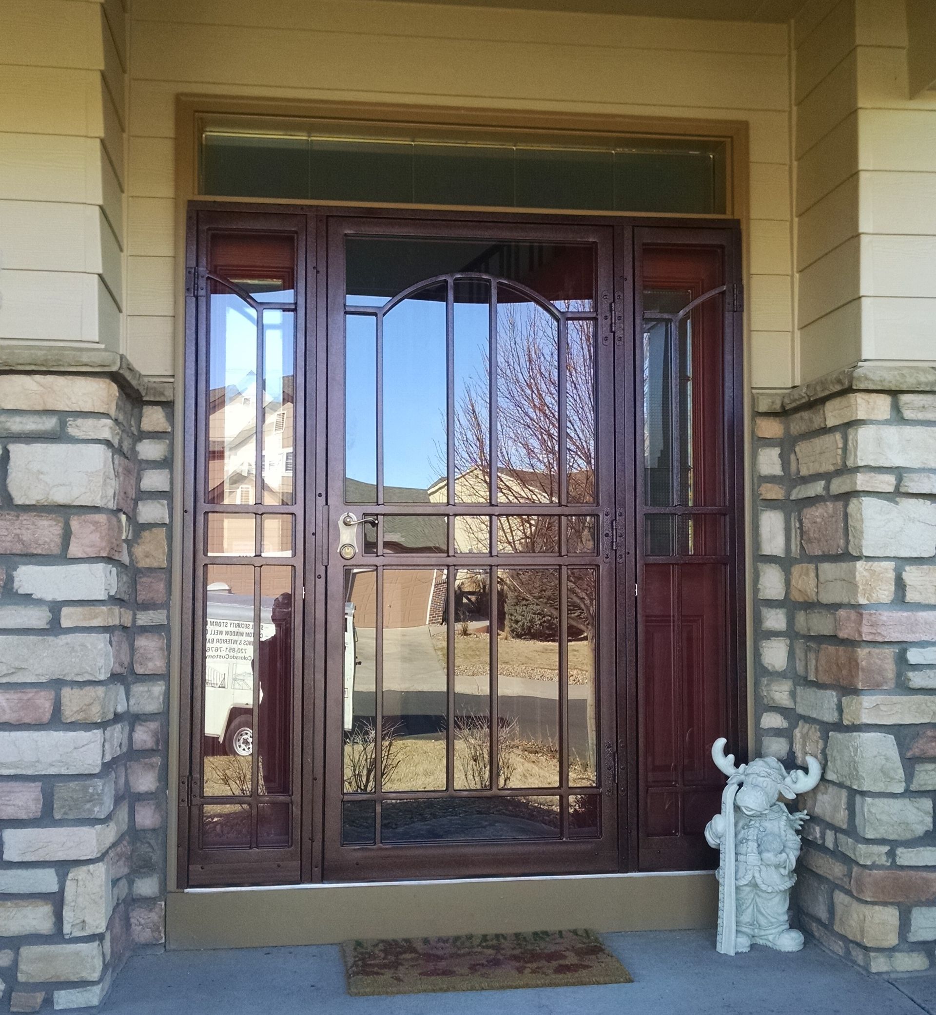 A door with a statue of a bull in front of it