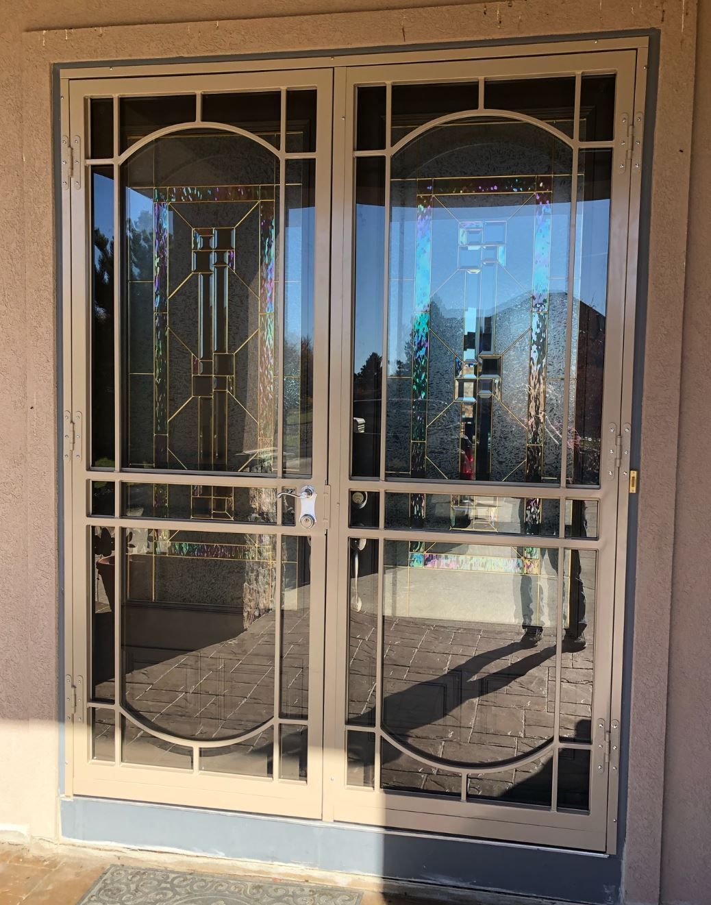 A white door with a stained glass design on it