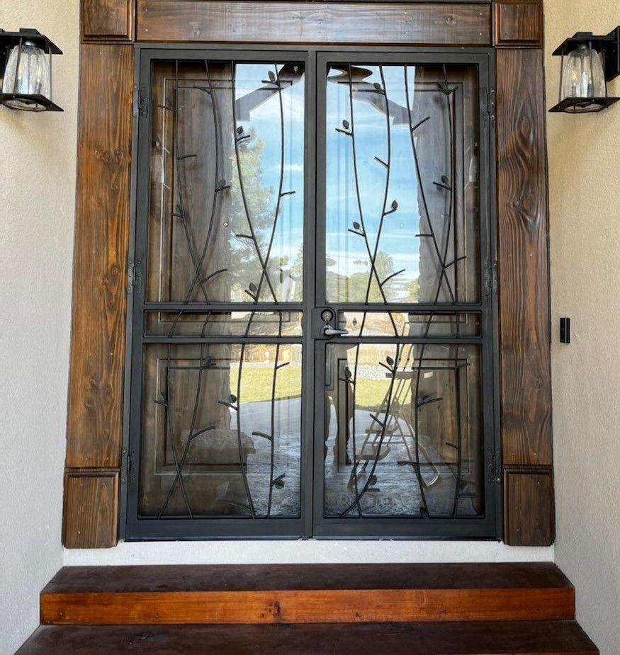 A door with a wrought iron design on it