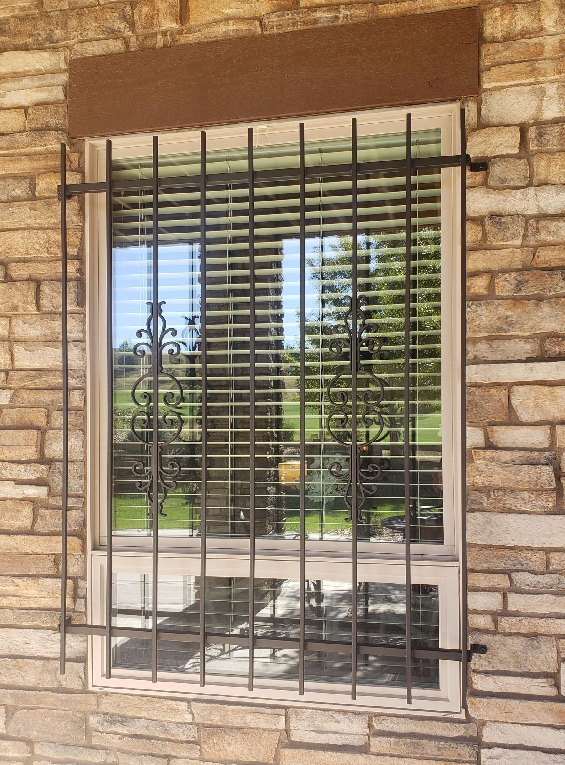 A brick wall with a window with bars on it