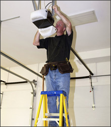 Man repairing a garage door opener