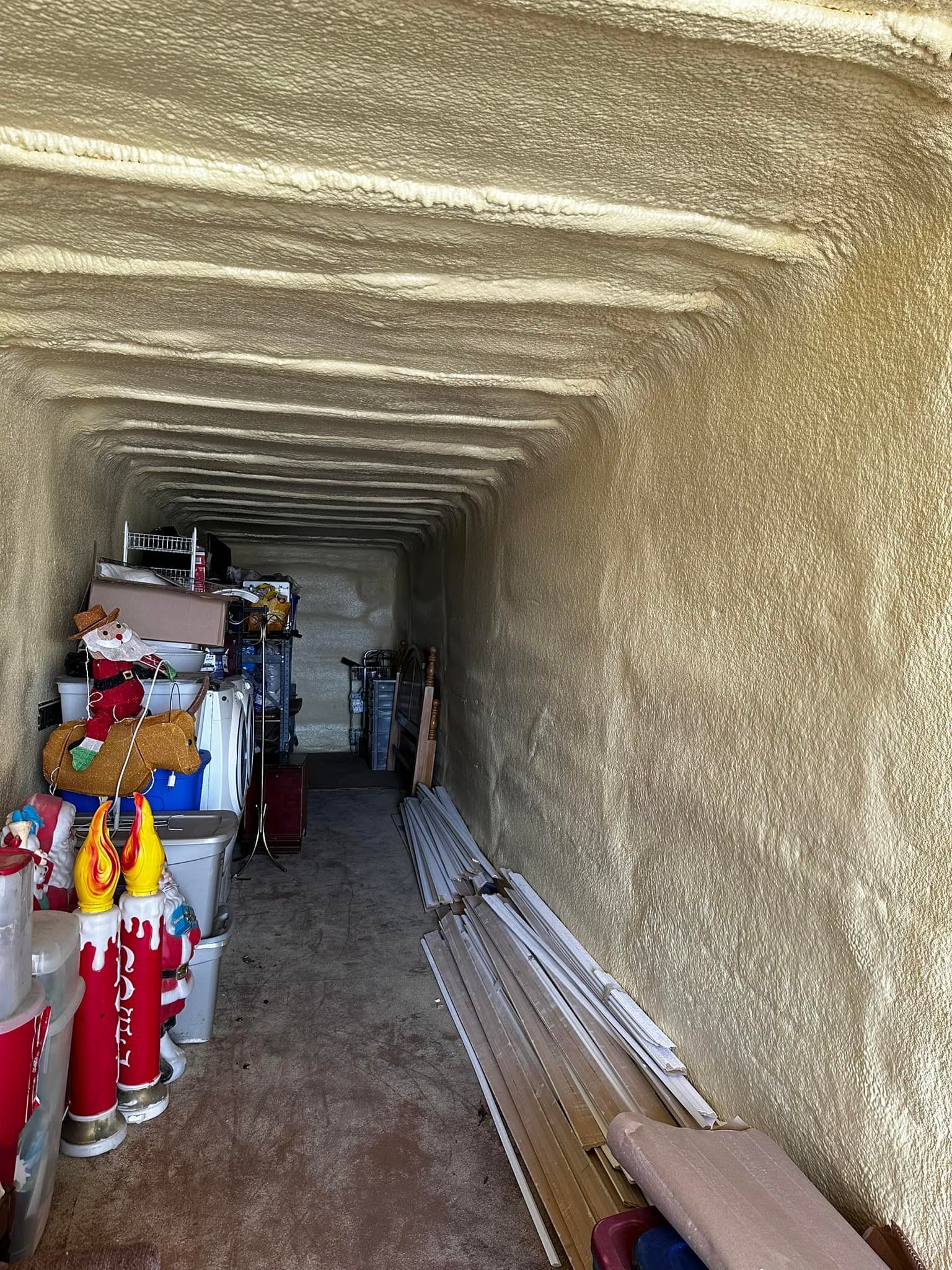 Storage unit filled with items, visible walls, and ceiling.