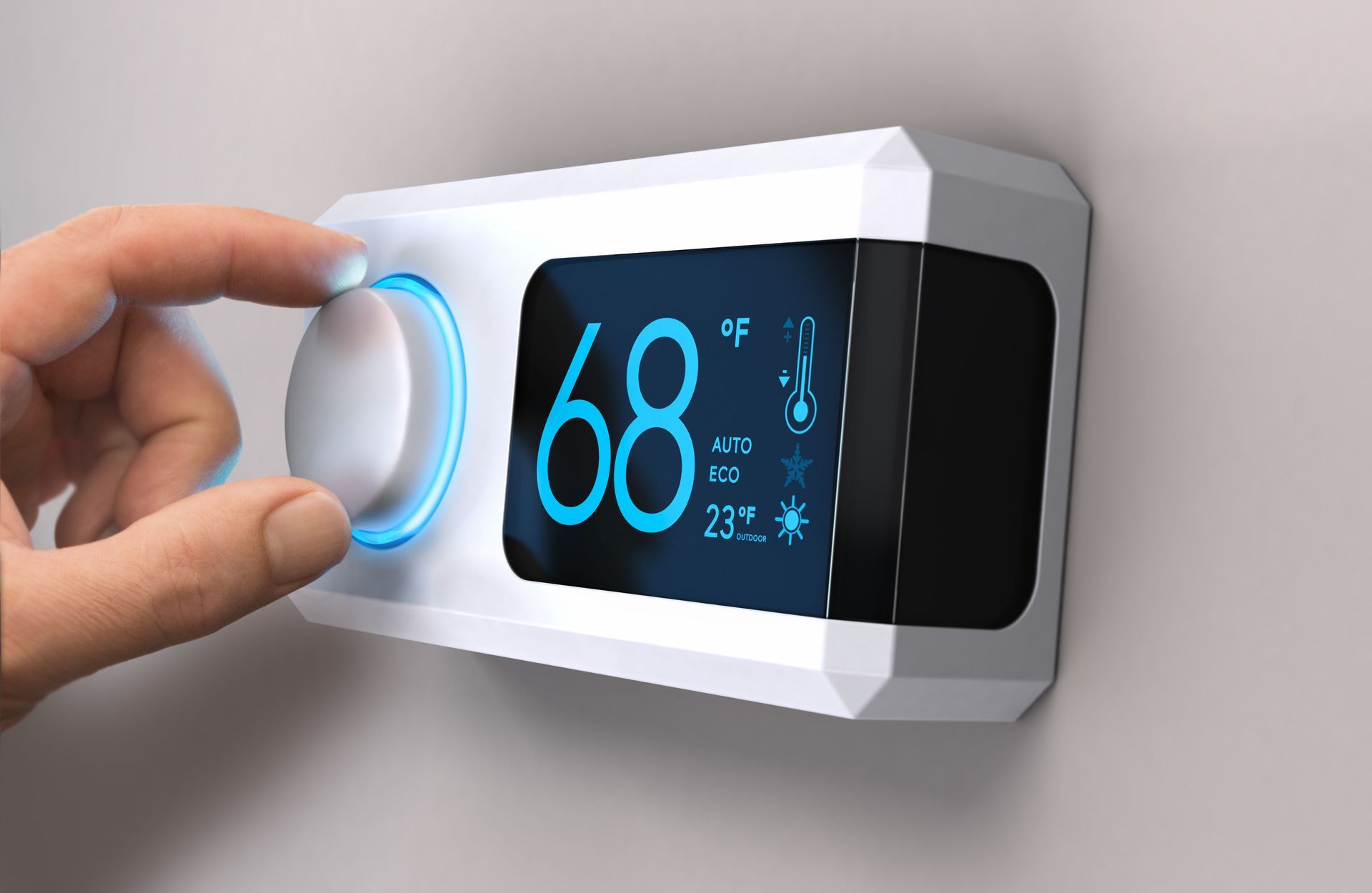 A person is adjusting a thermostat on a wall.