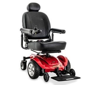 A red and black electric wheelchair on a white background.