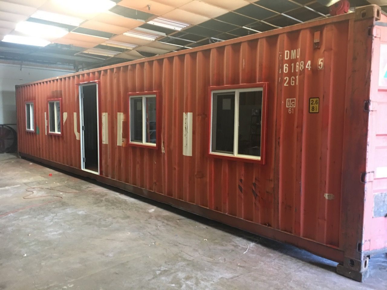 shipping container with windows and door