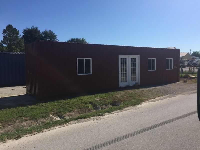 shipping container with windows and door