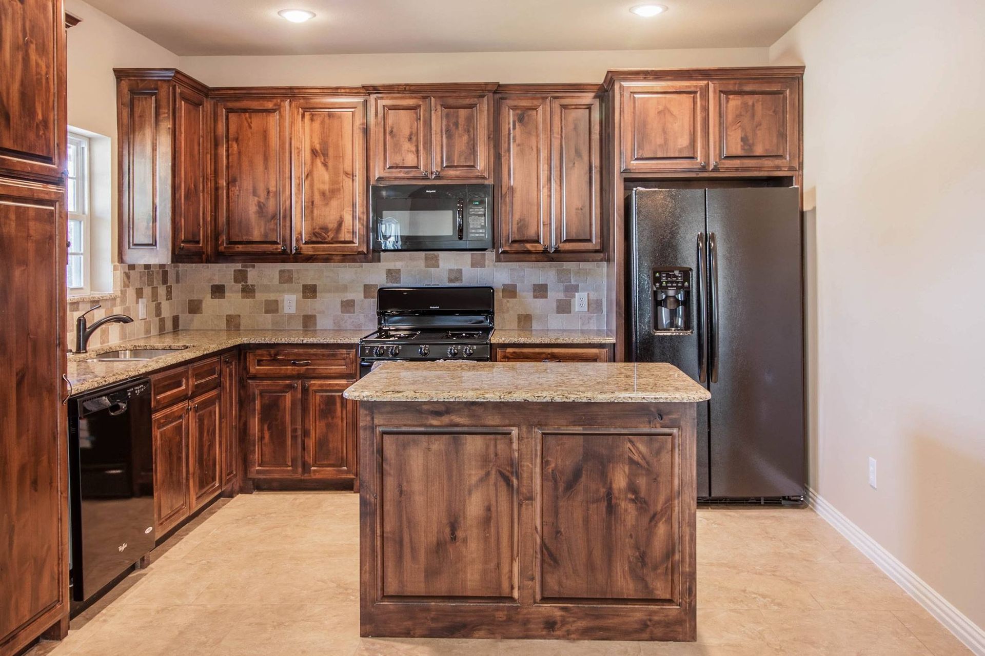 Kitchen with brown cabinets