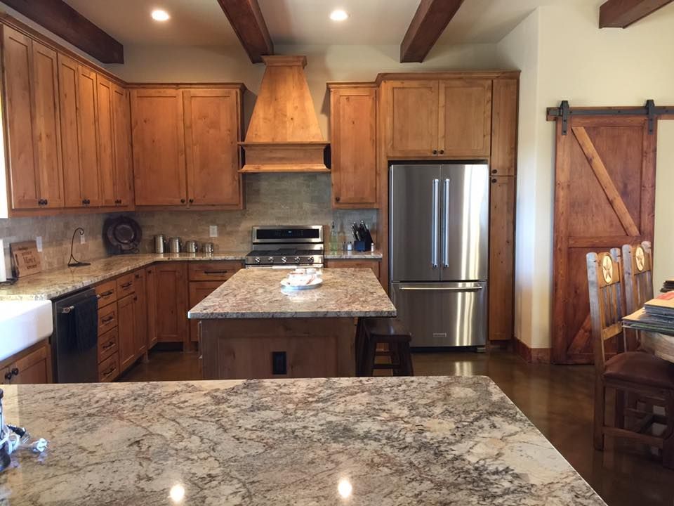 A kitchen with wooden cabinets