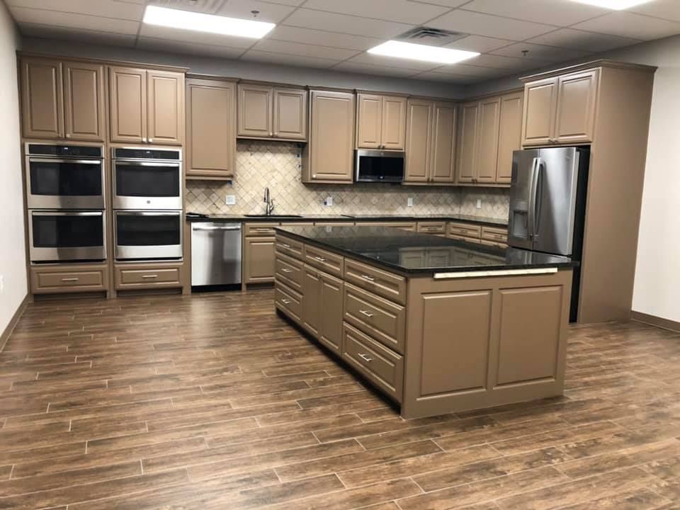 A large kitchen with a large island in the middle