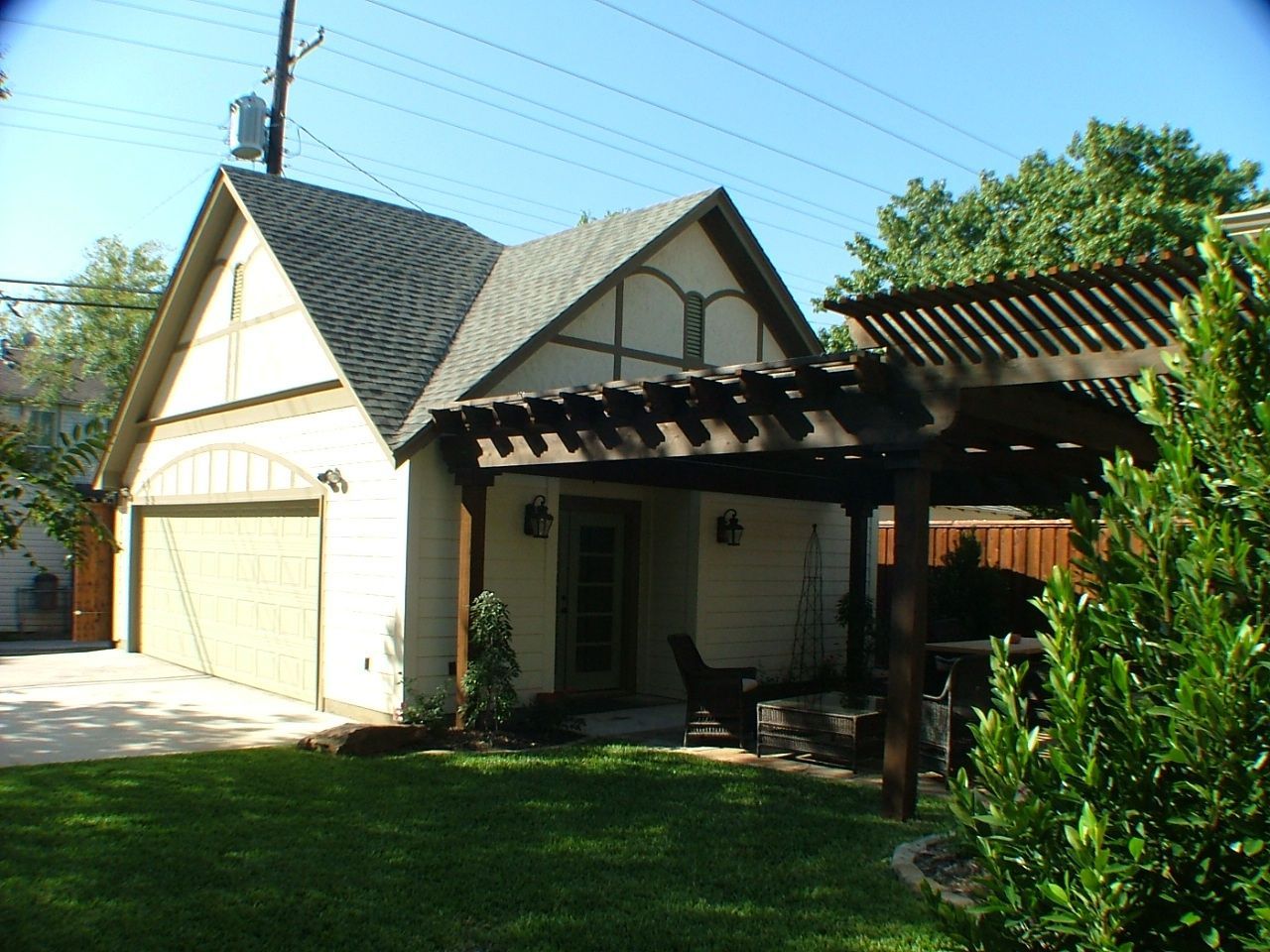 A garage connected to a covered patio