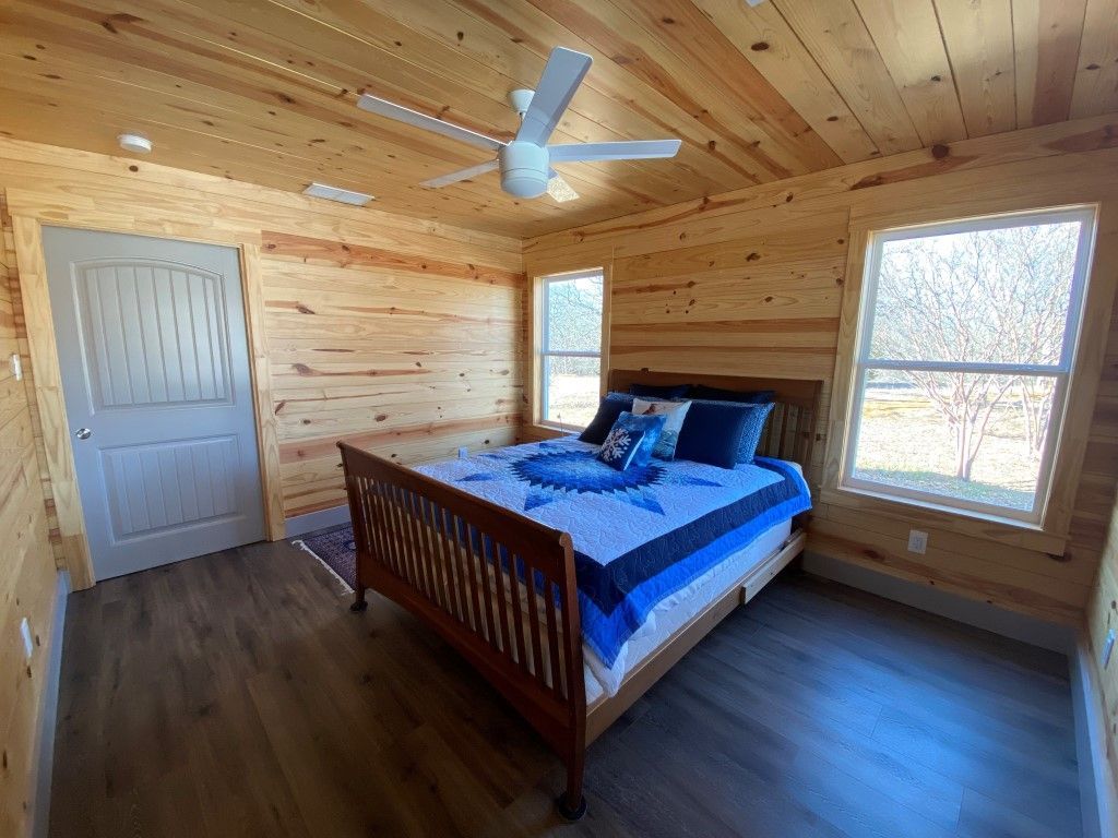 Cozy bedroom with two huge windows