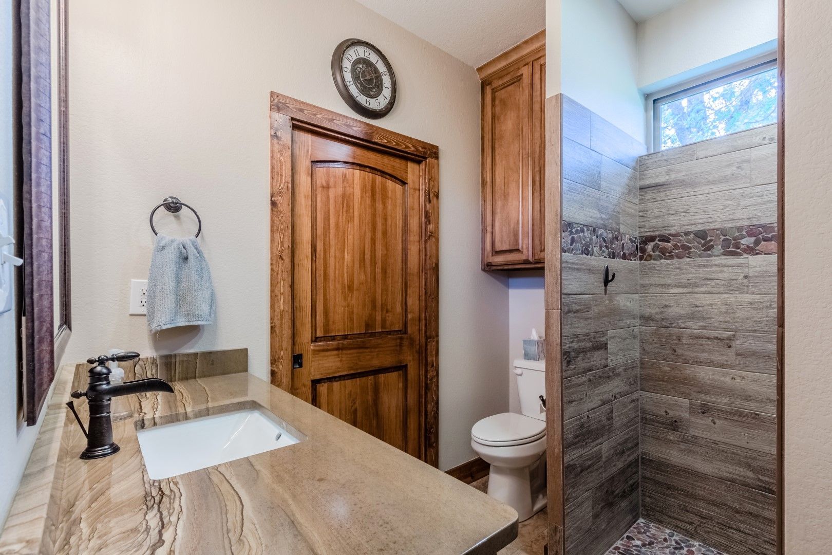 A bathroom with a wooden door