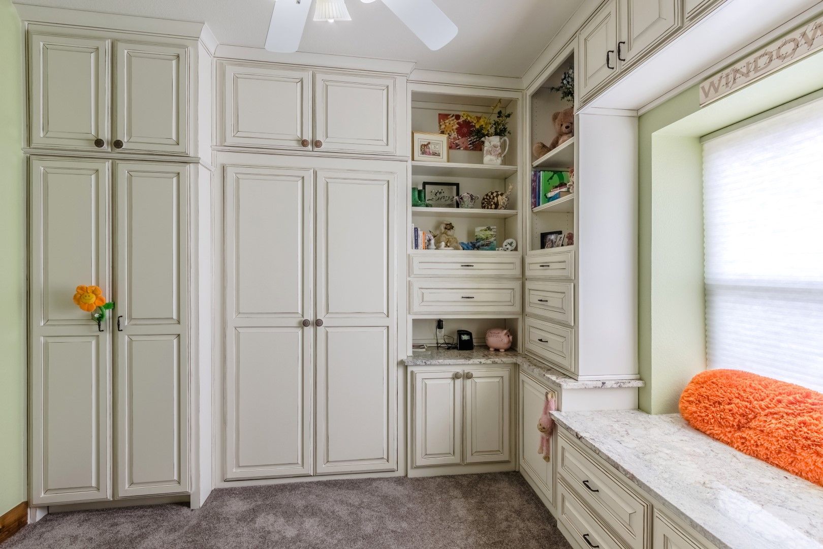floor-to-ceiling cabinets and a bay window
