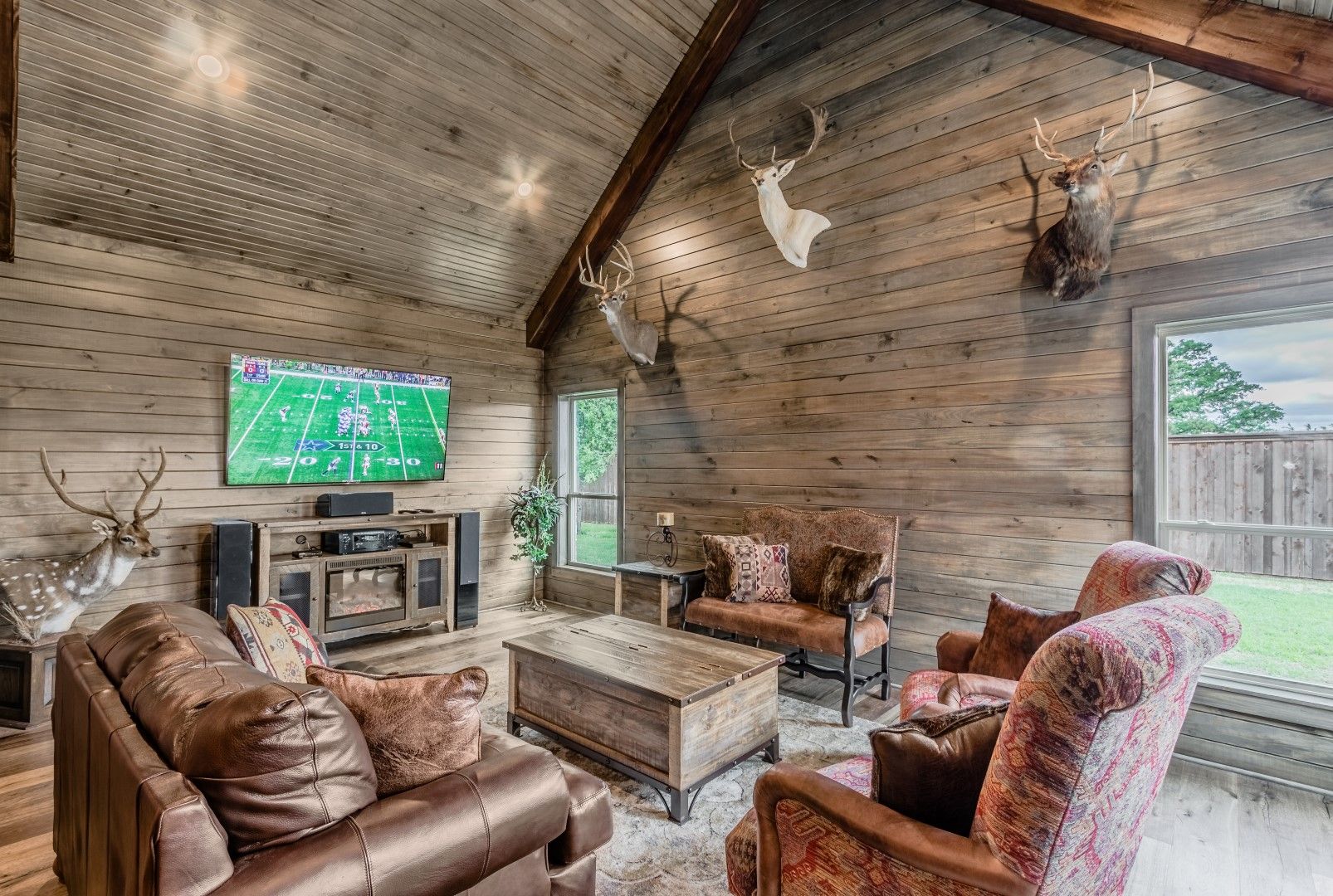 A living room filled with furniture and a flat screen tv.