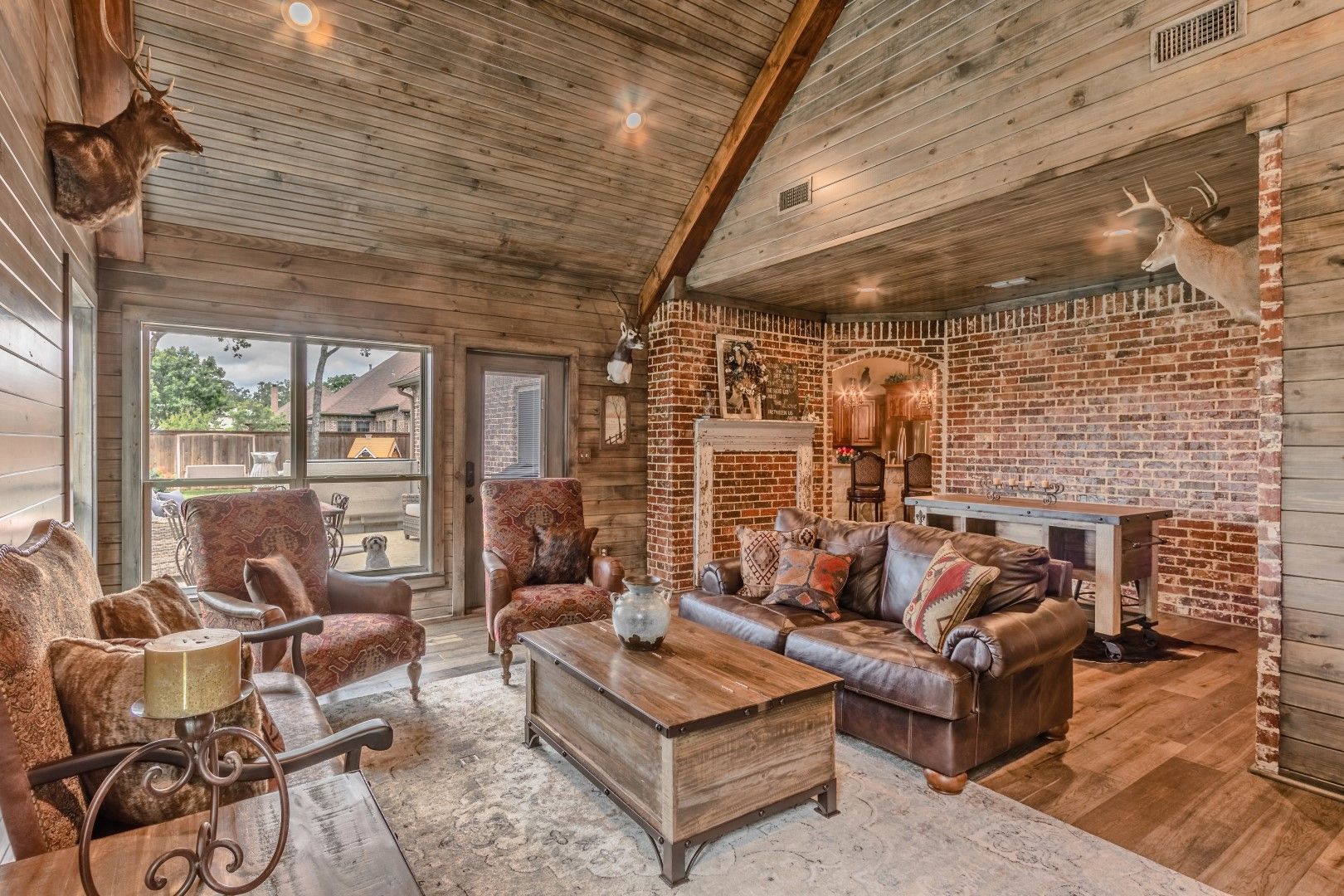 cozy living room with wood and brick elements