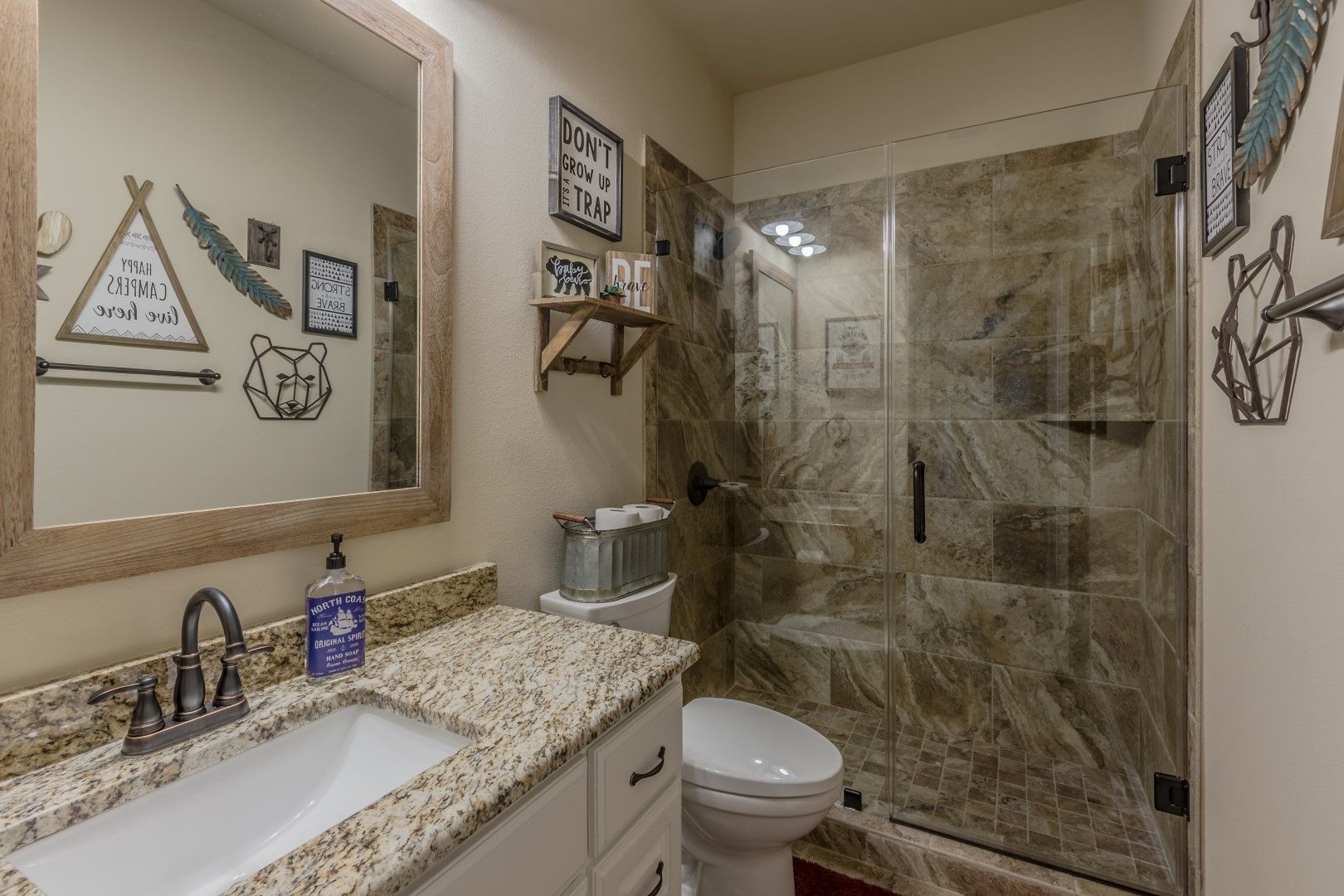 A bathroom with wall decorations