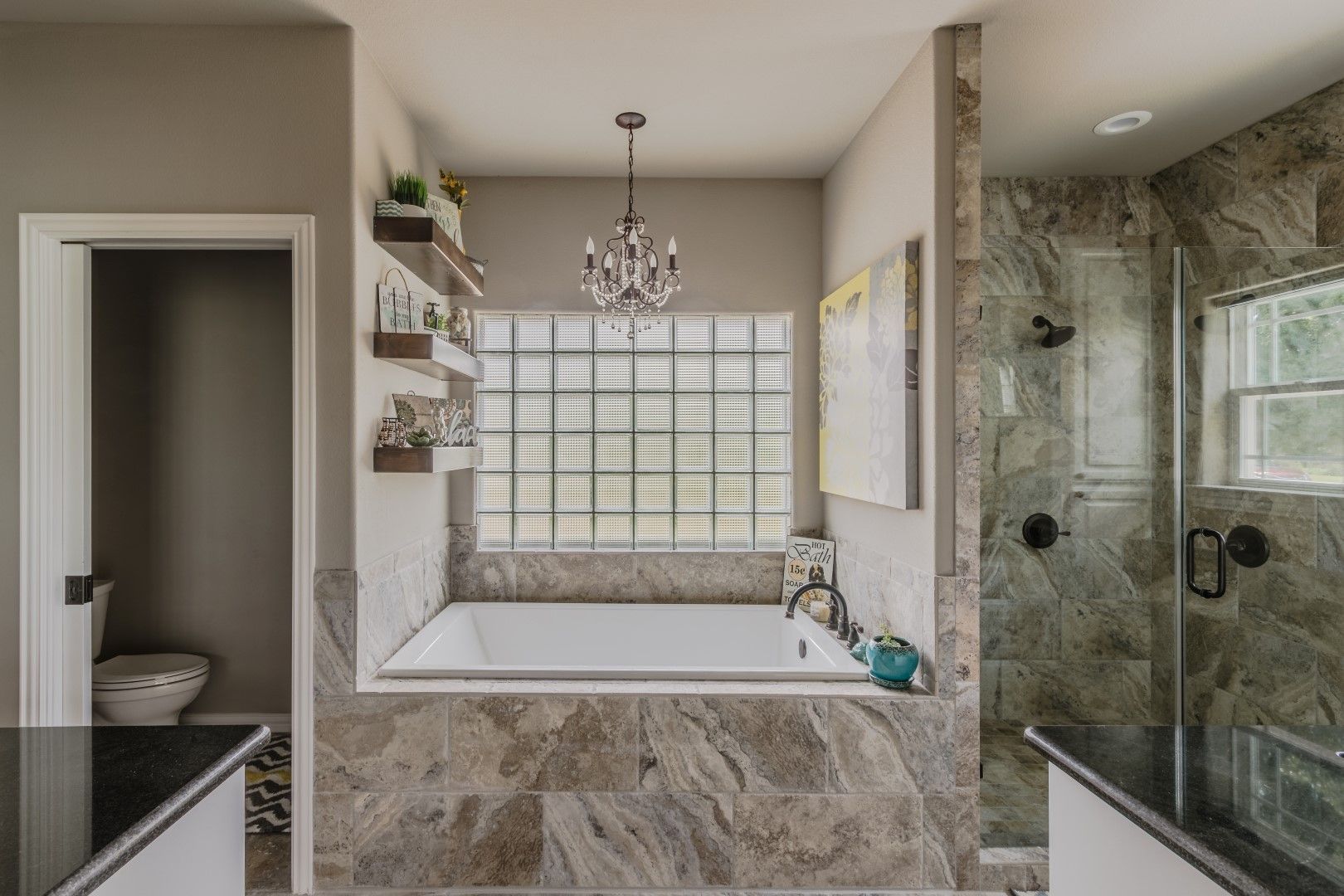 A bathroom with a beautiful chandelier