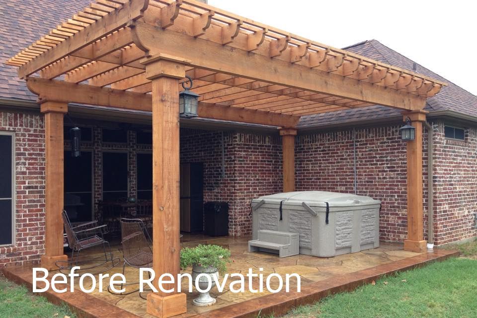 A patio with a pergola and a hot tub