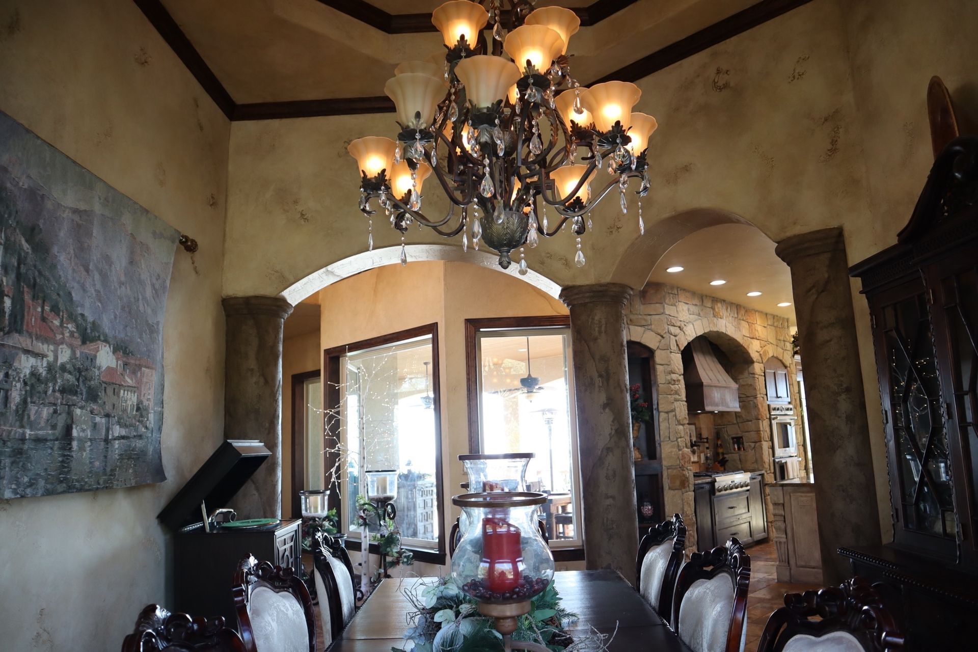 a dining room with a table and chairs and a chandelier