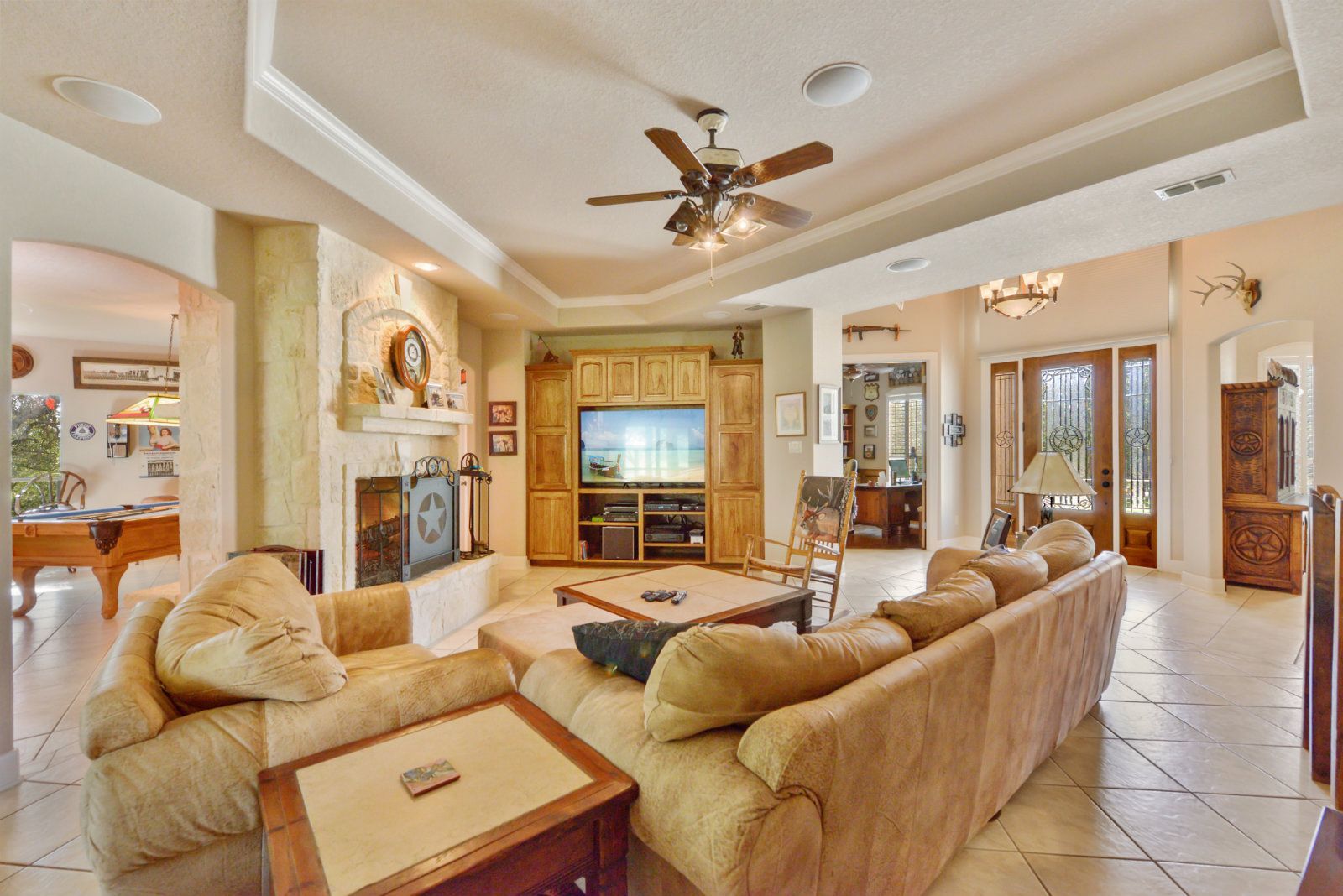 A living room filled with furniture and a ceiling fan